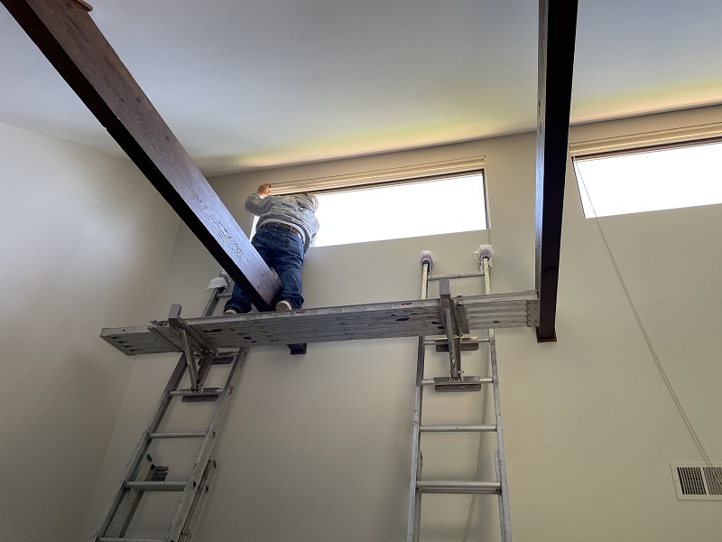 Windows Solutions Plus master installer working on this window replacement in Norwalk.